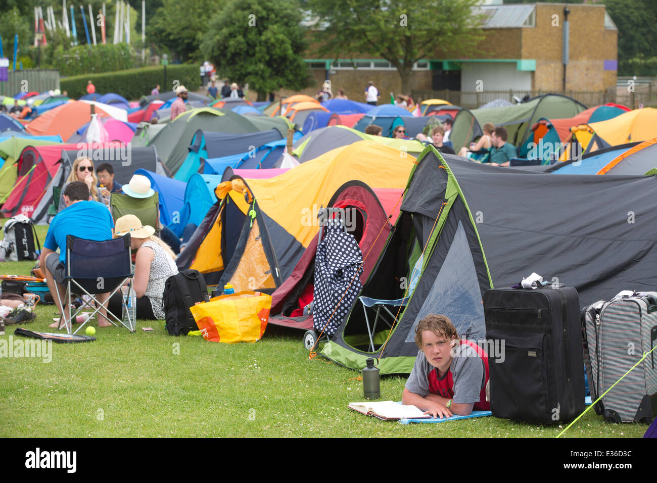 Wimbledon Park, London, UK. 22nd June, 2014. Tennis enthusiasts camp in Wimbledon Park overnight hoping to get a ticket for the opening match in Centre Court to see Andy Murray defend his title. Credit:  Clickpics/Alamy Live News Stock Photo