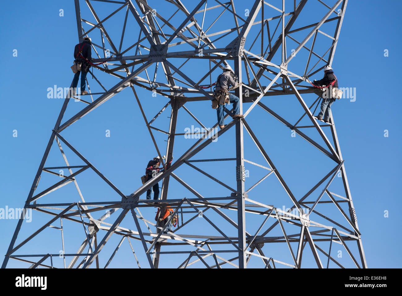 Construction crew assembling electricity transmission tower in Utah
