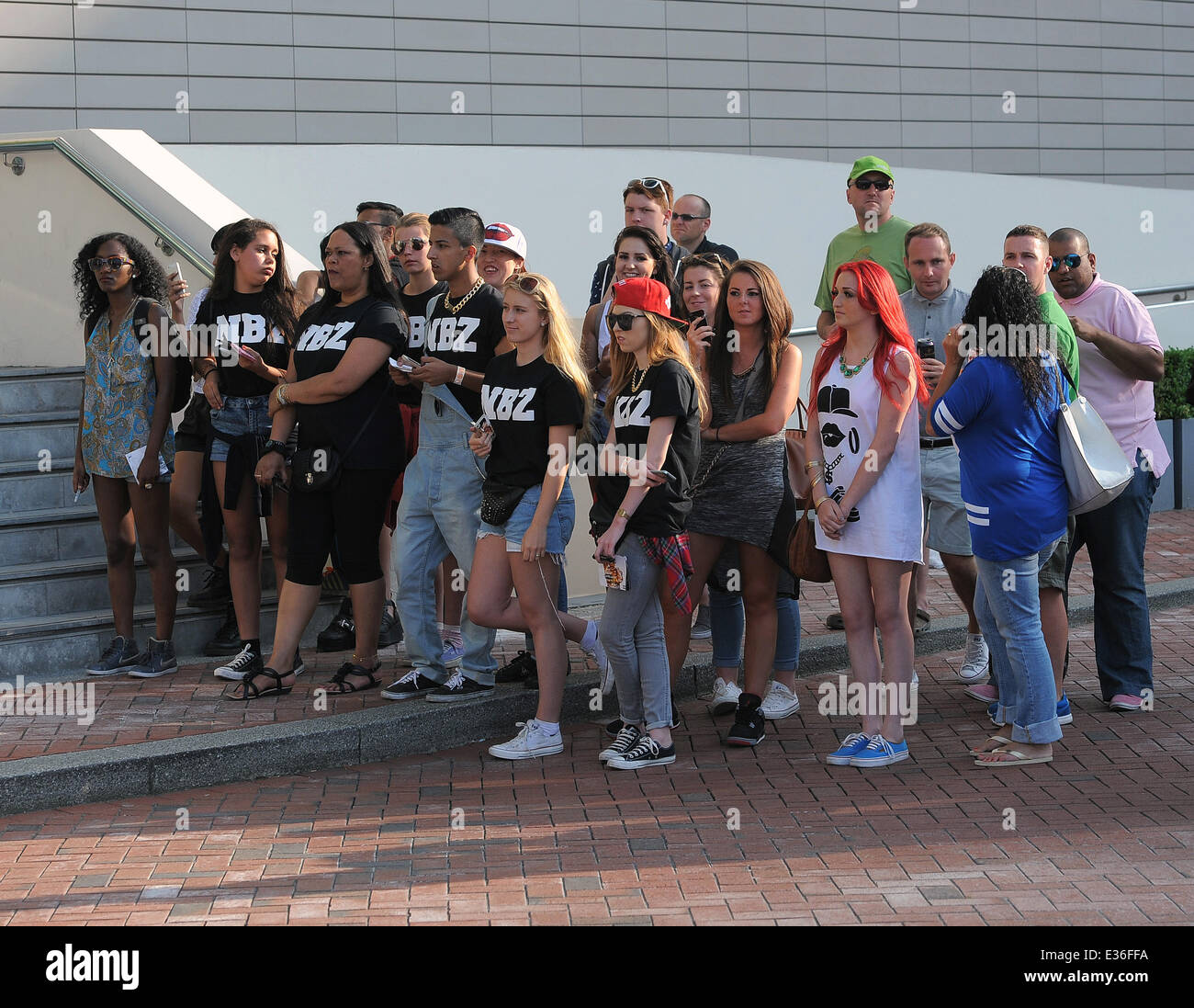 Rihanna fans patiently wait to catch a glimpse of the star leaving her
