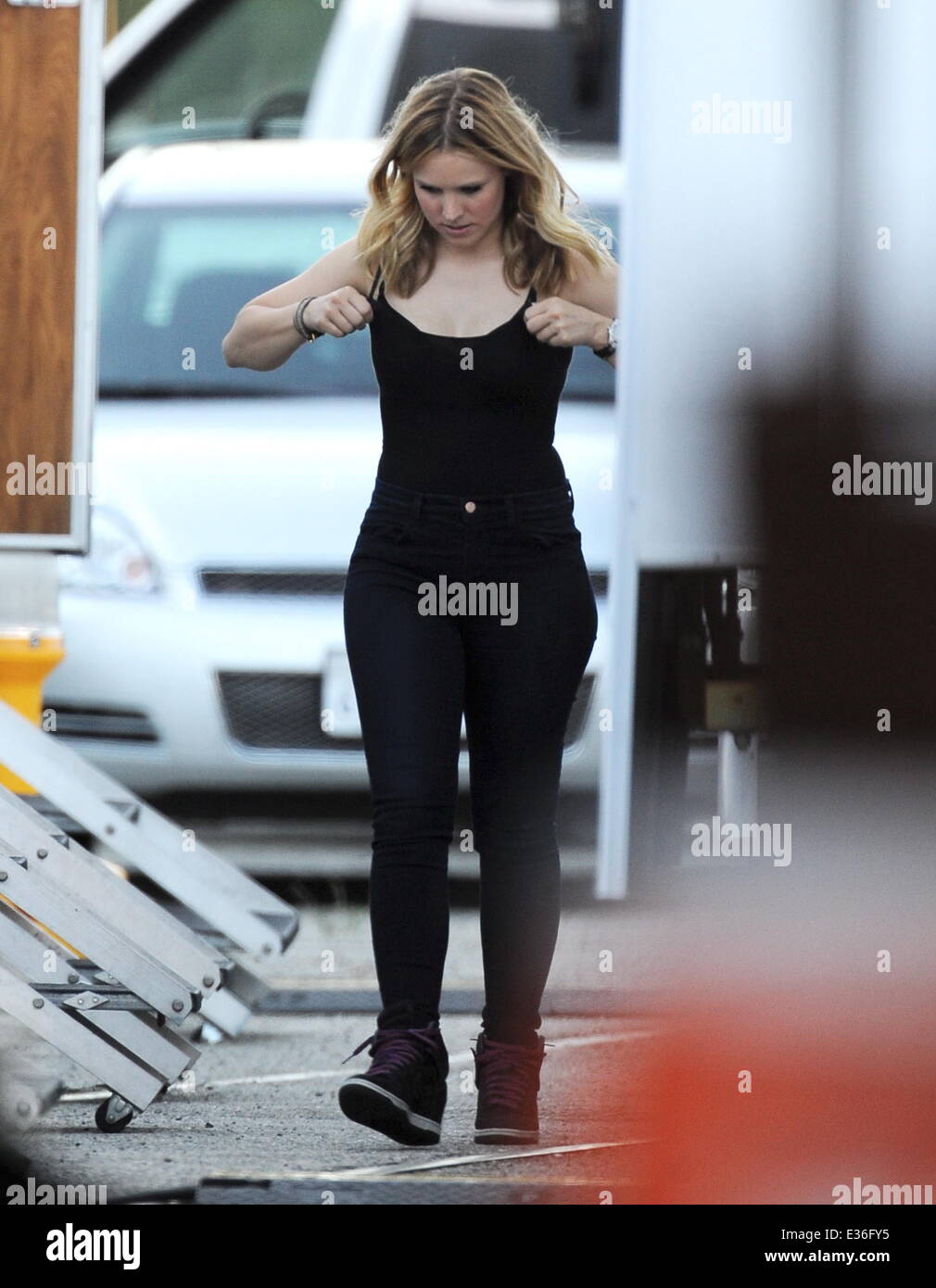 Kristen Bell shows off her slim down body while on the filmset of 'Veronica  Mars' in Downtown Los Angeles. At one point, The actress was seen adjusting  her bulging boobs during lunch