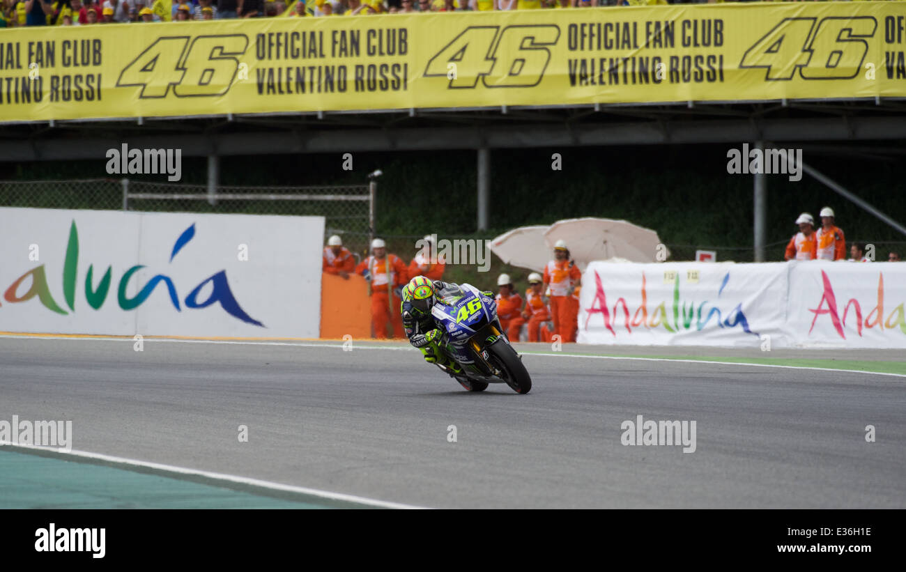 Valentino Rossi passes the huge fan club sign during the 7th race of the  2014 FIM MotoGP at Catalunya Circuit Stock Photo - Alamy