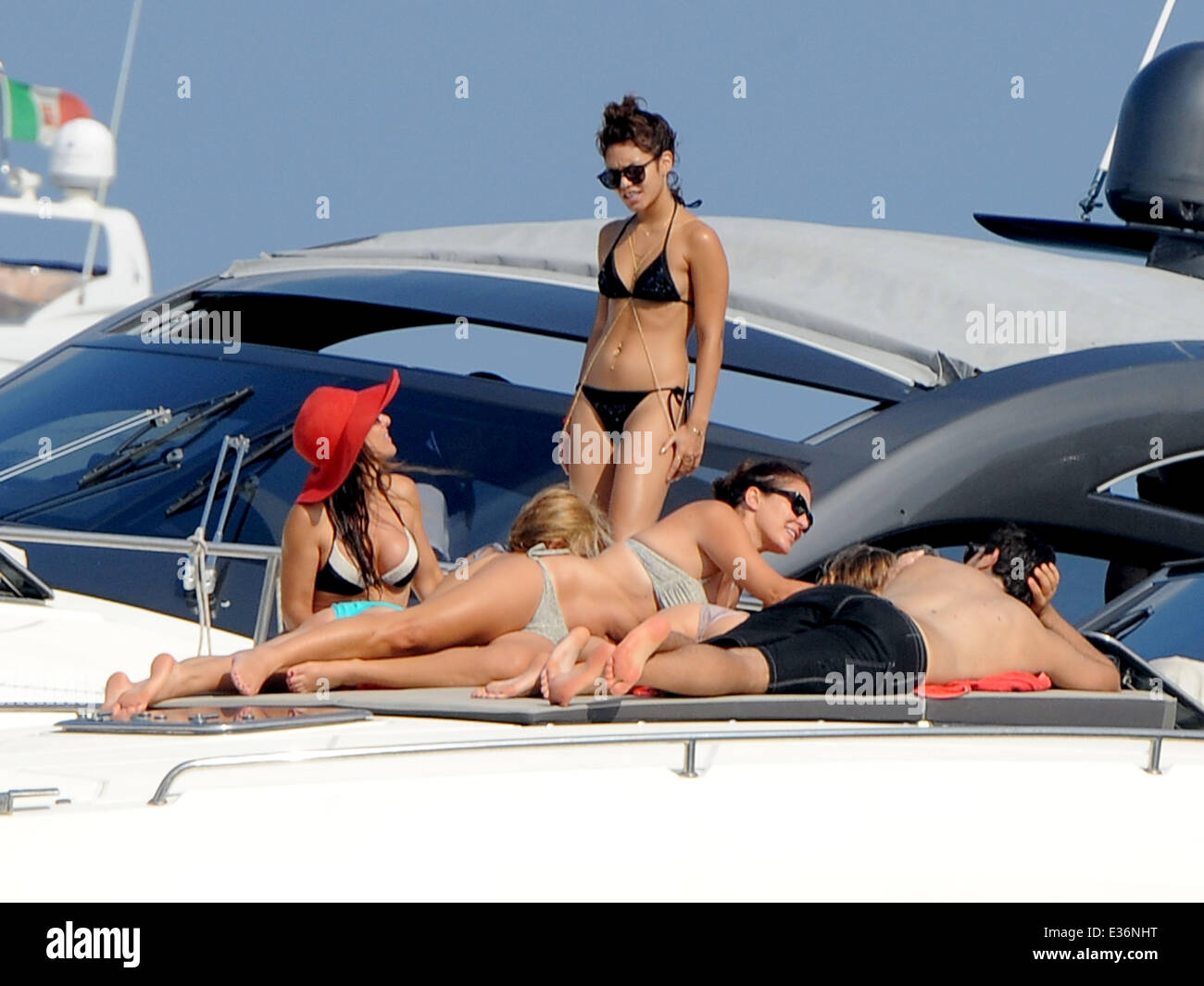 Vanessa Hudgens spends time on a boat with friends, including film directors Eli Roth and Terry Gilliam.  Featuring: Vanessa Hudgens Where: Ischia, Italy When: 19 Jul 2013   **** Stock Photo