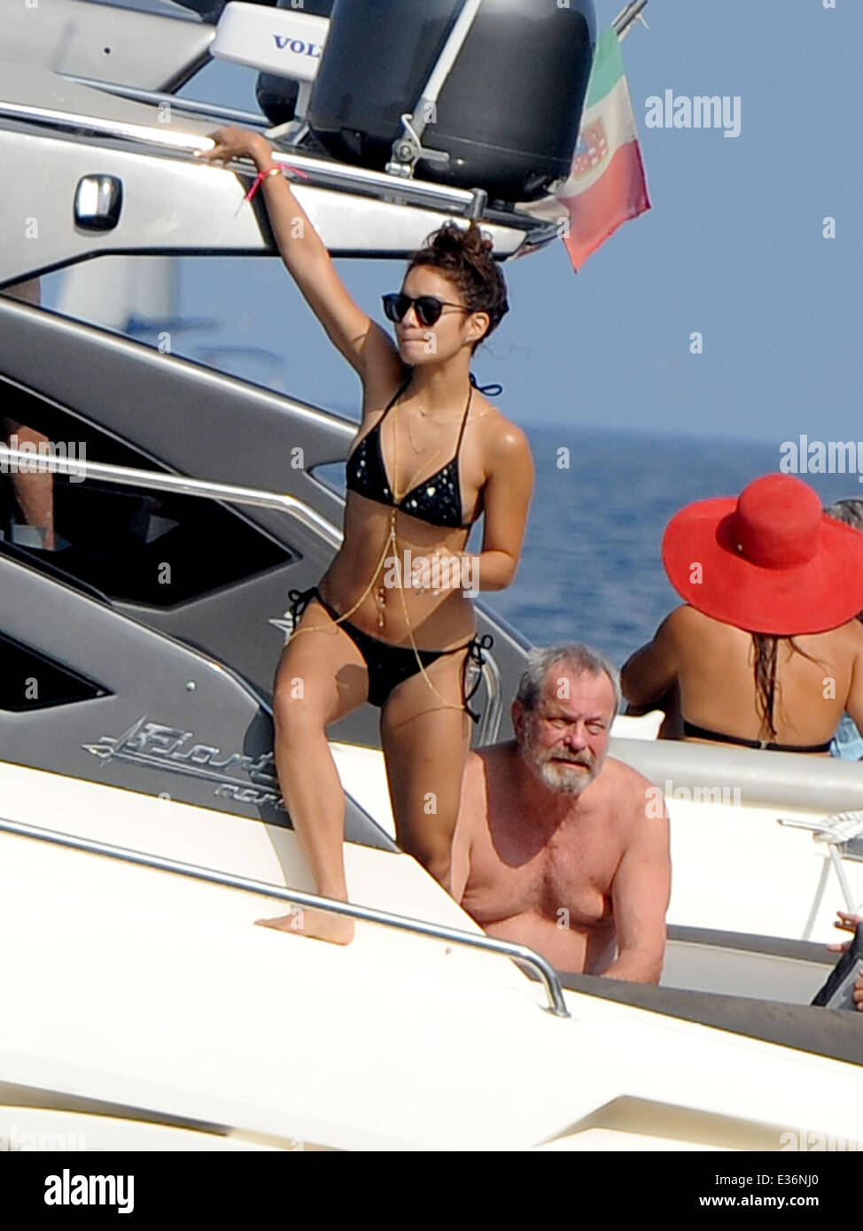 Vanessa Hudgens spends time on a boat with friends, including film directors Eli Roth and Terry Gilliam.  Featuring: Vanessa Hudgens,Terry Gilliam Where: Ischia, Italy When: 19 Jul 2013 Stock Photo