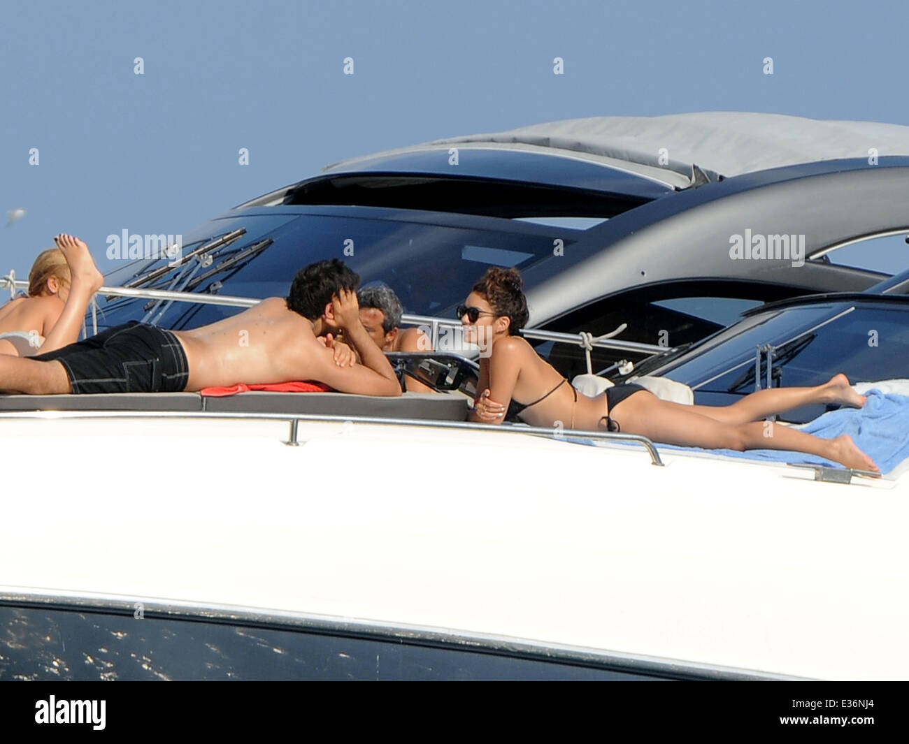 Vanessa Hudgens spends time on a boat with friends, including film directors Eli Roth and Terry Gilliam.  Featuring: Vanessa Hudgens,Eli Roth Where: Ischia, Italy When: 19 Jul 2013 Stock Photo