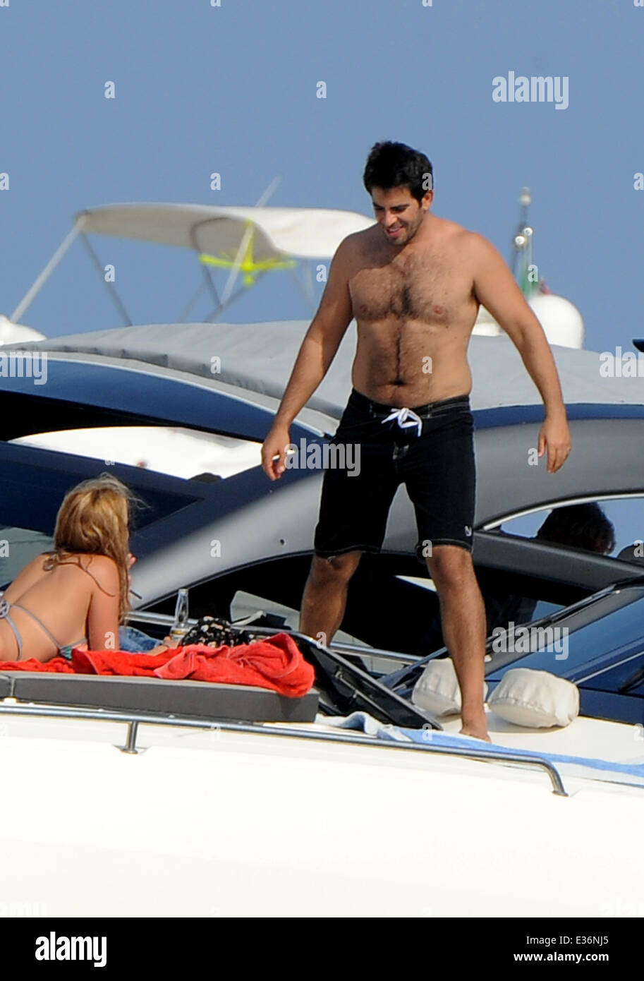 Vanessa Hudgens spends time on a boat with friends, including film directors Eli Roth and Terry Gilliam.  Featuring: Eli Roth Where: Ischia, Italy When: 19 Jul 2013 Stock Photo