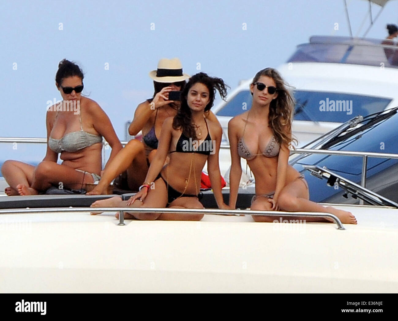 Vanessa Hudgens spends time on a boat with friends, including film directors Eli Roth and Terry Gilliam.  Featuring: Vanessa Hudgens Where: Ischia, Italy When: 19 Jul 2013 Stock Photo