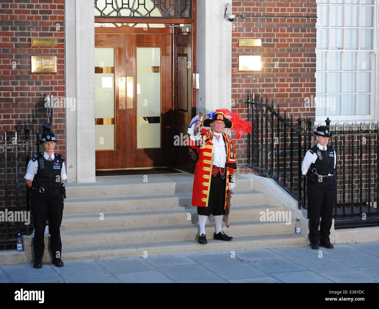 The town crier announced the birth of the new royal baby outside St