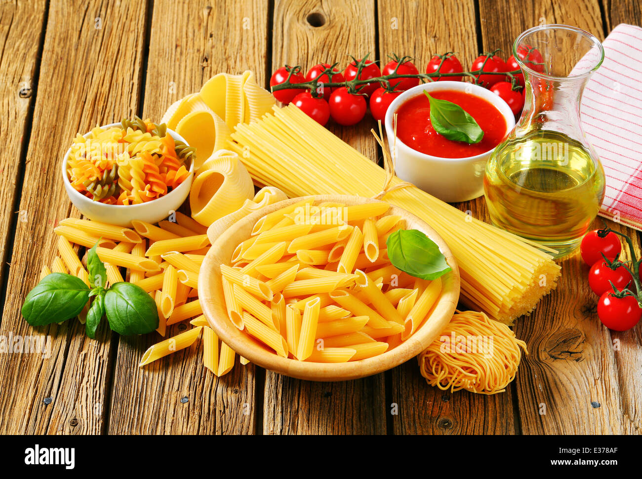 Assorted pasta, tomato passata and olive oil Stock Photo Alamy