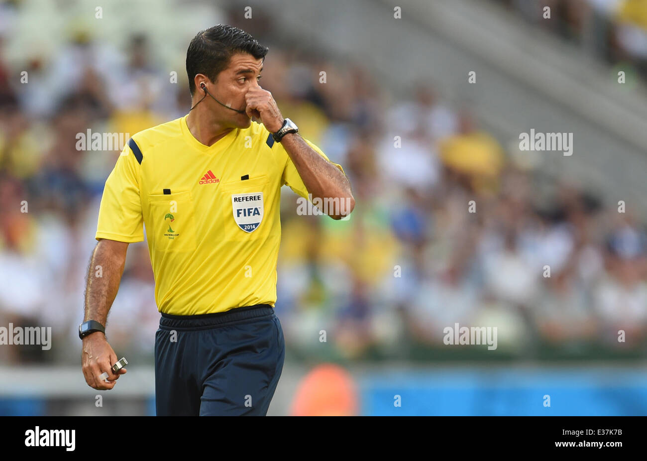 Referee Sandro Ricci of Brazil gestures during the FIFA World Cup 2014 group G preliminary round match between Germany and Ghana at the Estadio Castelao Stadium in Fortaleza, Brazil, 21 June 2014. Photo: Andreas Gebert/dpa (RESTRICTIONS APPLY: Editorial Use Only, not used in association with any commercial entity - Images must not be used in any form of alert service or push service of any kind including via mobile alert services, downloads to mobile devices or MMS messaging - Images must appear as still images and must not emulate match action video footage - No alteration is made to, and no  Stock Photo