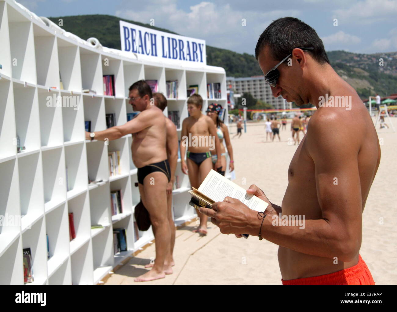 Bulgaria opens its first beach library in the Albena resort. On its shelves are over 2500 volumes in more than 10 languages. The library is completely free and the titles are carefully selected for all tastes - world classics, thrillers, mysteries, romantic readings, memoirs. Tourists can take a book for free without a library card. If they haven't read the book they have taken, they can leave their own book in return in order to diversify the collection. Thus, the library will be filled with new titles.  Where: Albena, Bulgaria When: 04 Aug 2013 Stock Photo