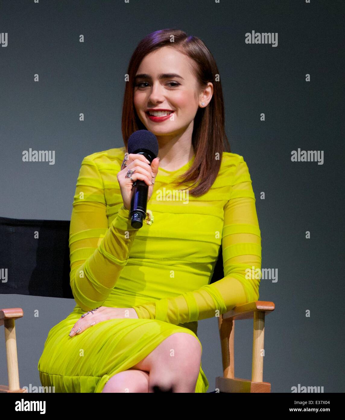 Lily Collins discusses 'The Mortal Instruments: City of Bones,' her new film about half-angel warriors who protect our world fro Stock Photo