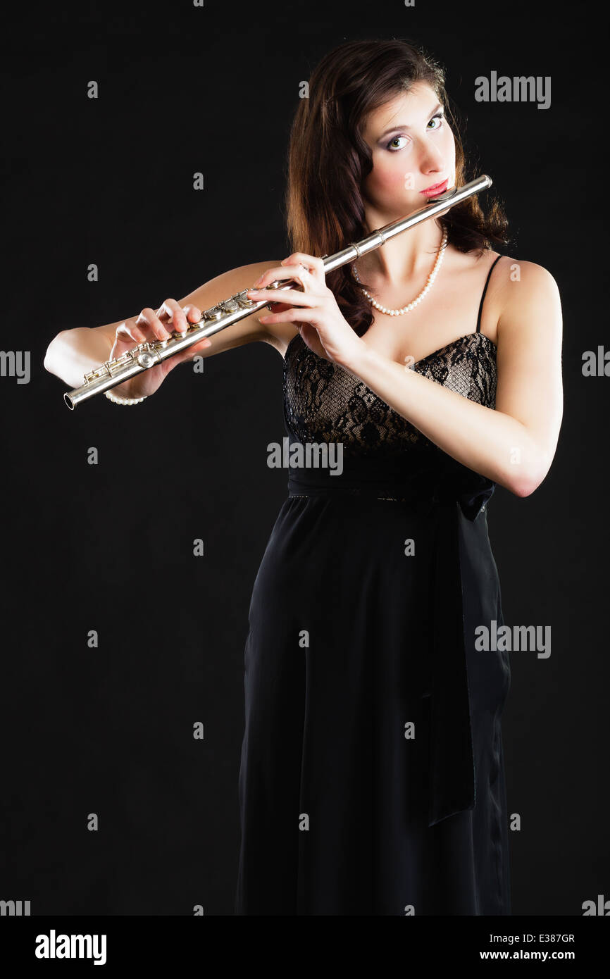 Art and artist. Young elegant woman girl flutist flautist performer