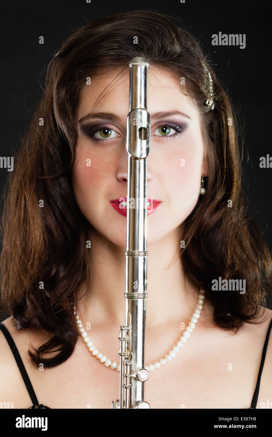 Art and artist. Portrait of woman girl flutist flautist performer with