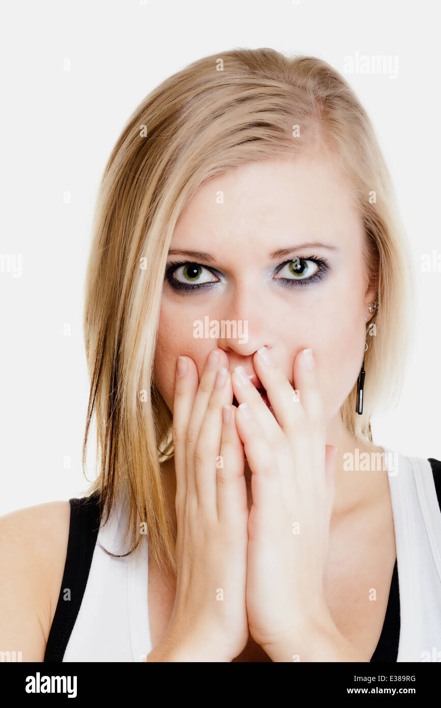 Body language and emotions. Surprised afraid blonde girl shocked young