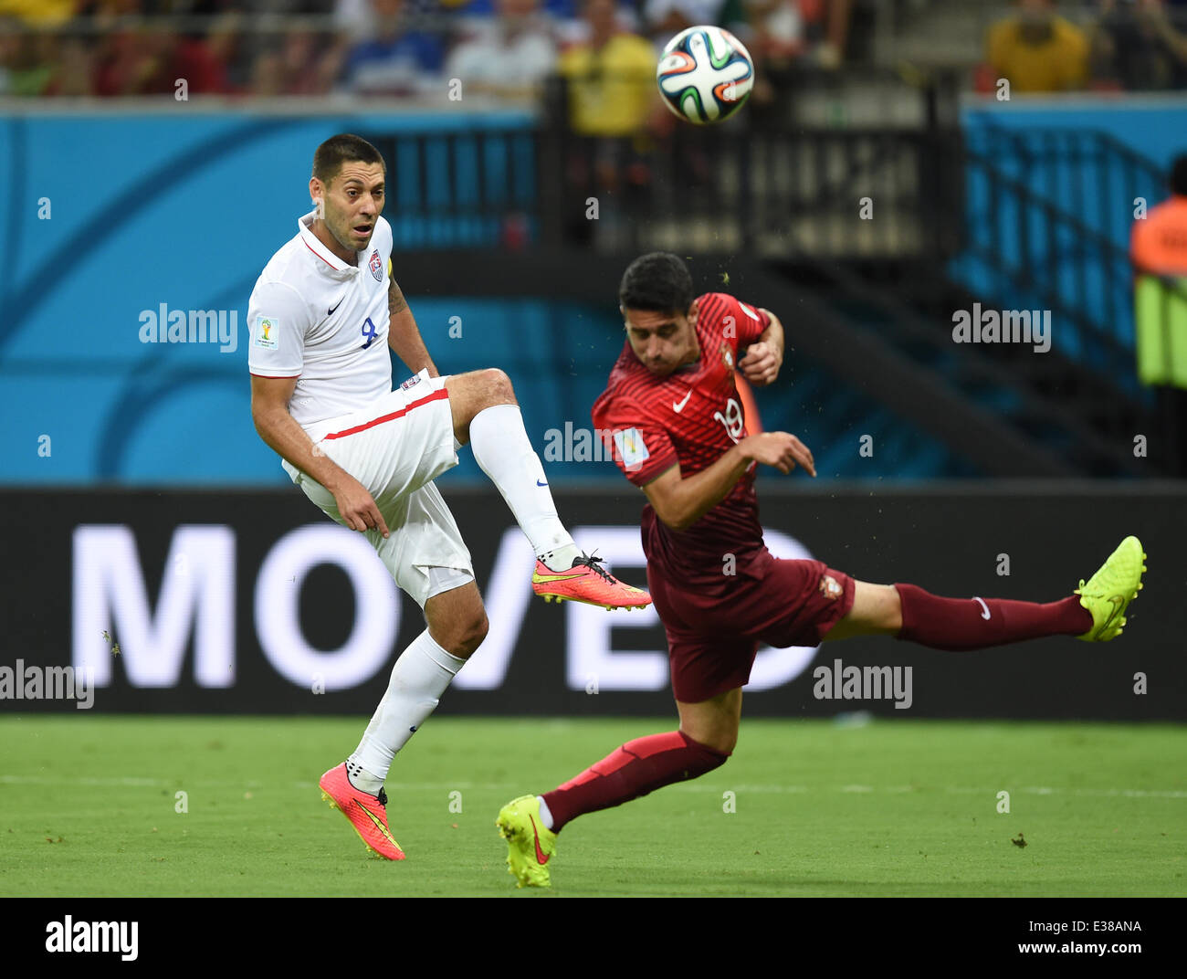 Manaus, Brazil. 22nd June, 2014. Andre Almeida of Portugal in action against Clint Dempsey (L) of USA during the FIFA World Cup 2014 group G preliminary round match between the USA and Portugal at the Arena Amazonia Stadium in Manaus, Brazil, 22 June 2014. Photo: Marius Becker/dpa/Alamy Live News Stock Photo