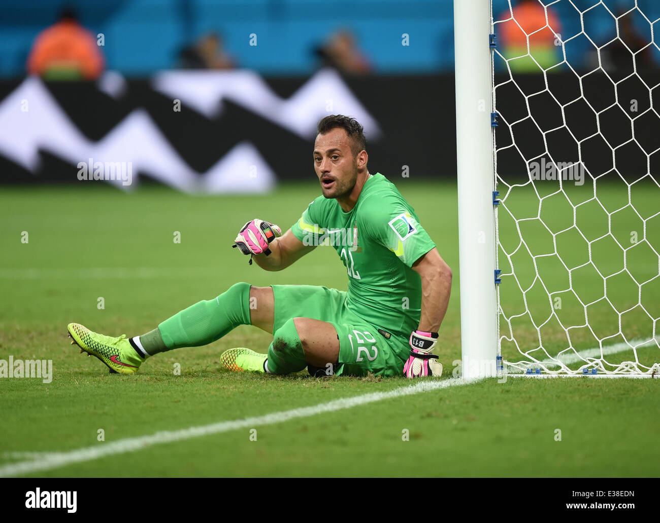 Manaus, Brazil. 22nd June, 2014. Goalkeeper Beto of Portugal sits on the pitch during the FIFA World Cup 2014 group G preliminary round match between the USA and Portugal at the Arena Amazonia Stadium in Manaus, Brazil, 22 June 2014. Photo: Marius Becker/dpa/Alamy Live News Stock Photo