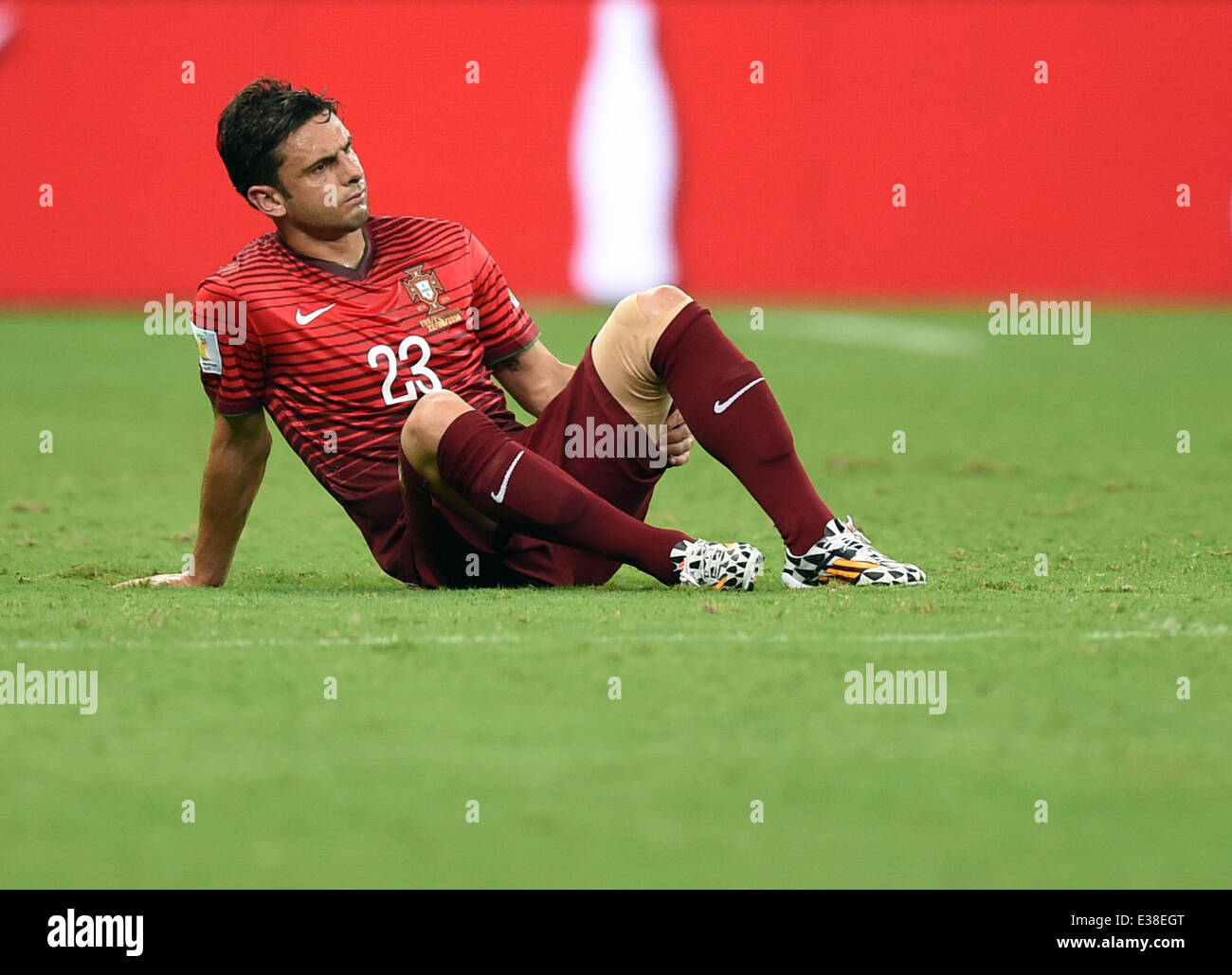 Manaus, Brazil. 22nd June, 2014. Helder Postiga of Portugal sits on the pitch during the FIFA World Cup 2014 group G preliminary round match between the USA and Portugal at the Arena Amazonia Stadium in Manaus, Brazil, 22 June 2014. Photo: Marius Becker/dpa/Alamy Live News Stock Photo