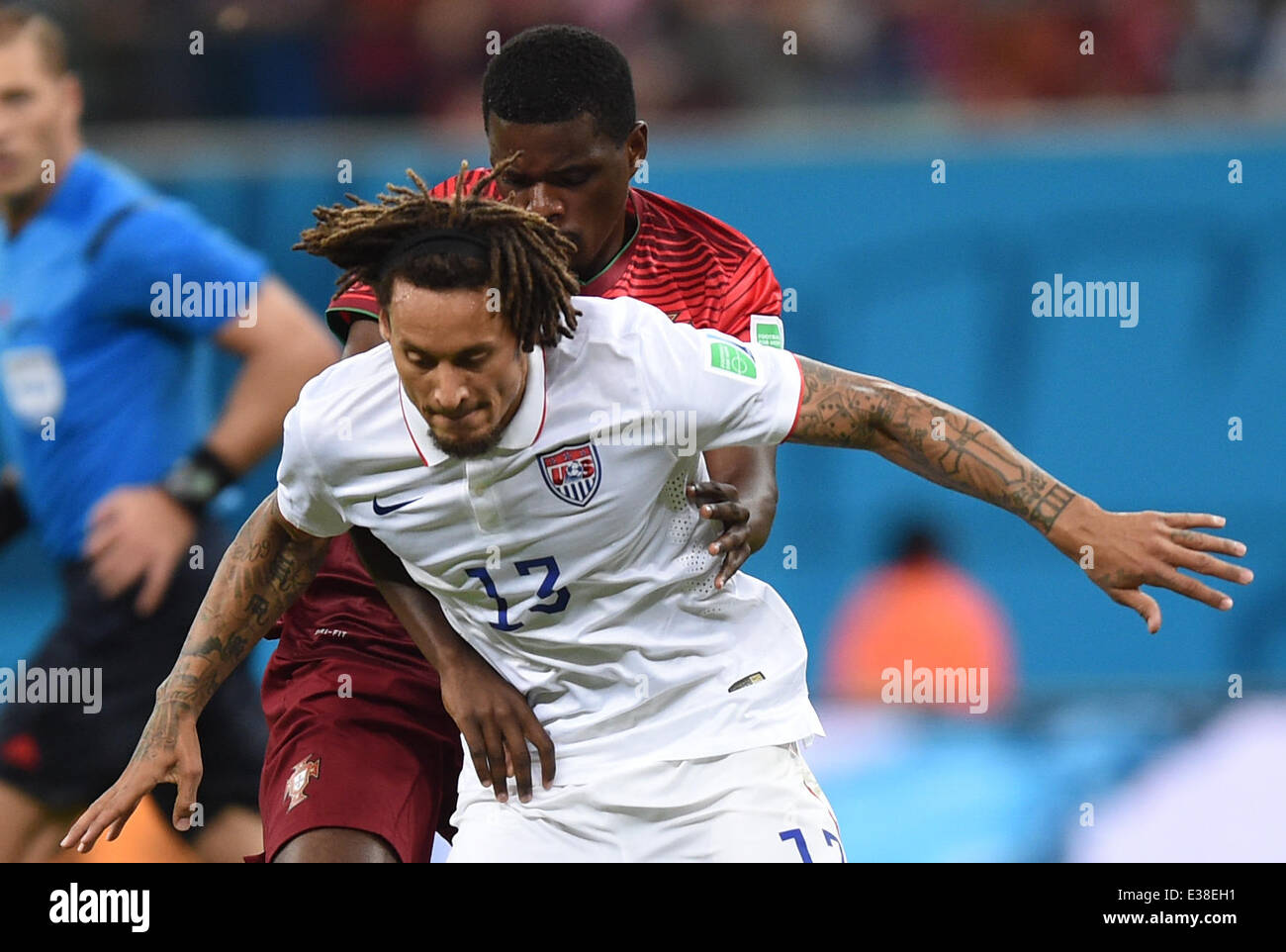 Manaus, Brazil. 22nd June, 2014. William Carvalho (L) of Portugal in action against Jermaine Jones of USA during the FIFA World Cup 2014 group G preliminary round match between the USA and Portugal at the Arena Amazonia Stadium in Manaus, Brazil, 22 June 2014. Photo: Marius Becker/dpa/Alamy Live News Stock Photo