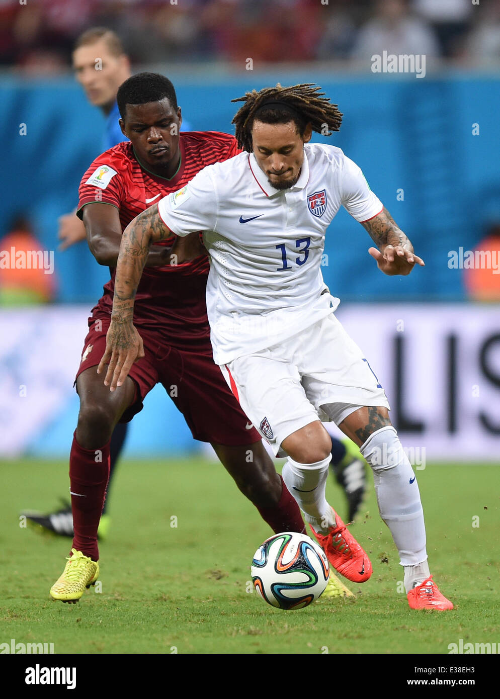 Manaus, Brazil. 22nd June, 2014. William Carvalho(L) of Portugal in action against Jermaine Jones of USA during the FIFA World Cup 2014 group G preliminary round match between the USA and Portugal at the Arena Amazonia Stadium in Manaus, Brazil, 22 June 2014. Photo: Marius Becker/dpa/Alamy Live News Stock Photo
