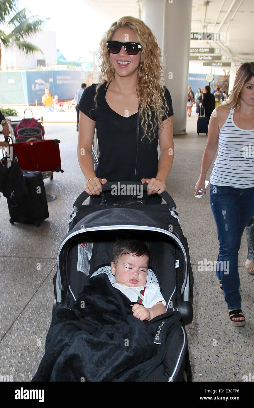 Shakira is seen arriving at LAX Airport with her son Milan Pique Mebarak  for a flight.