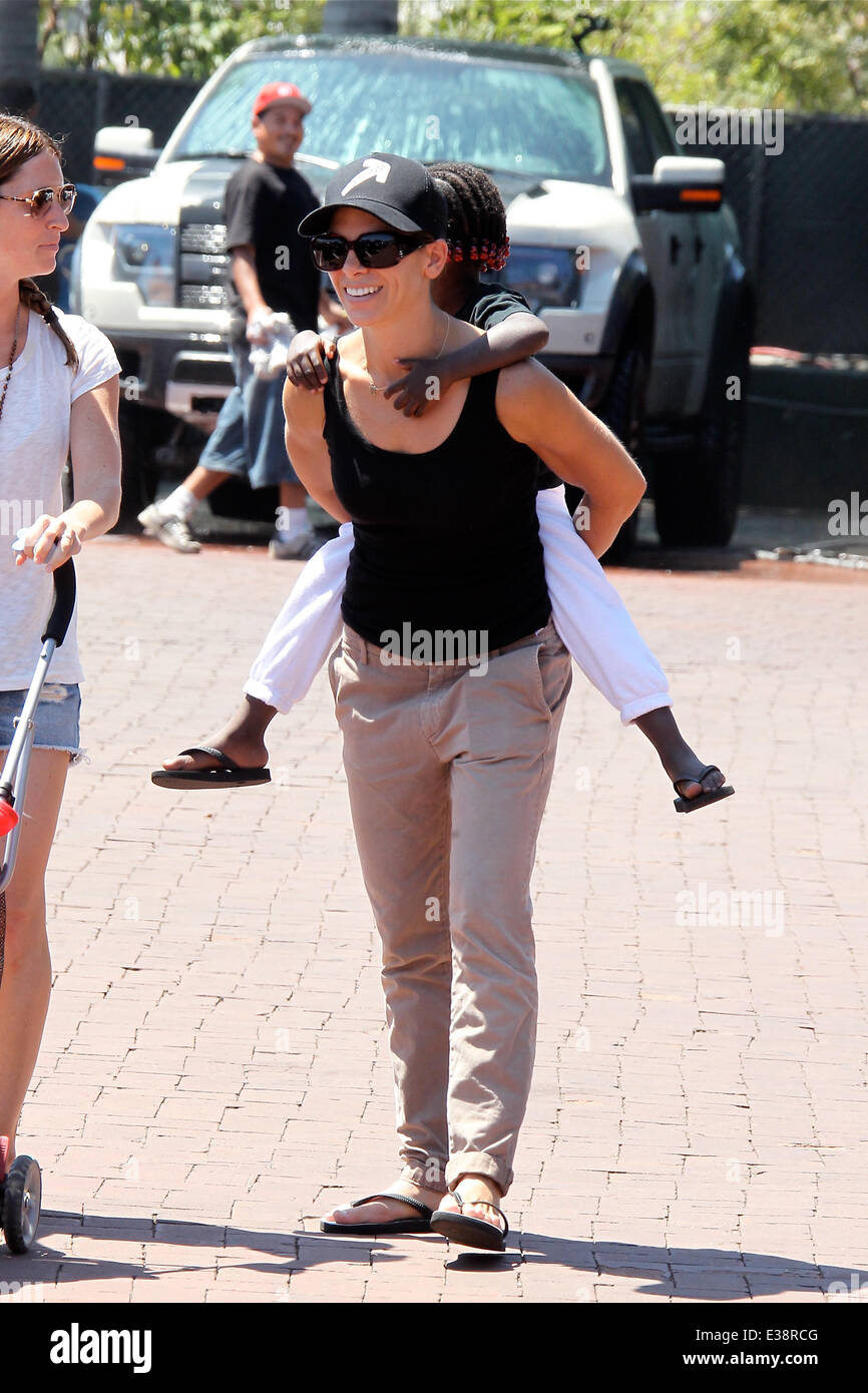 Jillian Michaels takes her daughter Lukensia by piggyback to the park