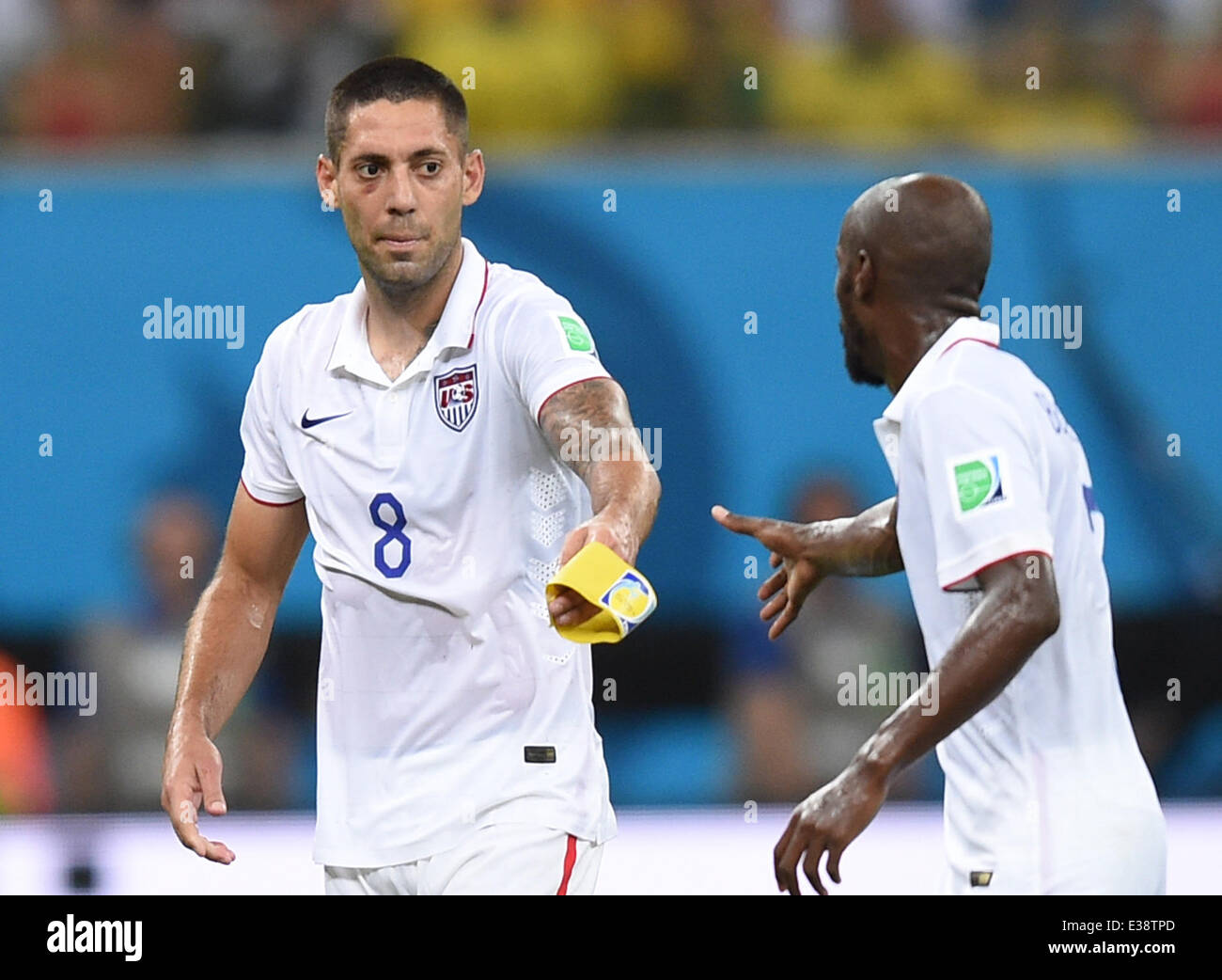 Manaus, Brazil. 22nd June, 2014. Clint Dempsey (L) of the USA on his way to the substitution during the the FIFA World Cup 2014 group G preliminary round match between the USA and Portugal at the Arena Amazonia Stadium in Manaus, Brazil, 22 June 2014. Photo: Marius Becker/dpa/Alamy Live News Stock Photo