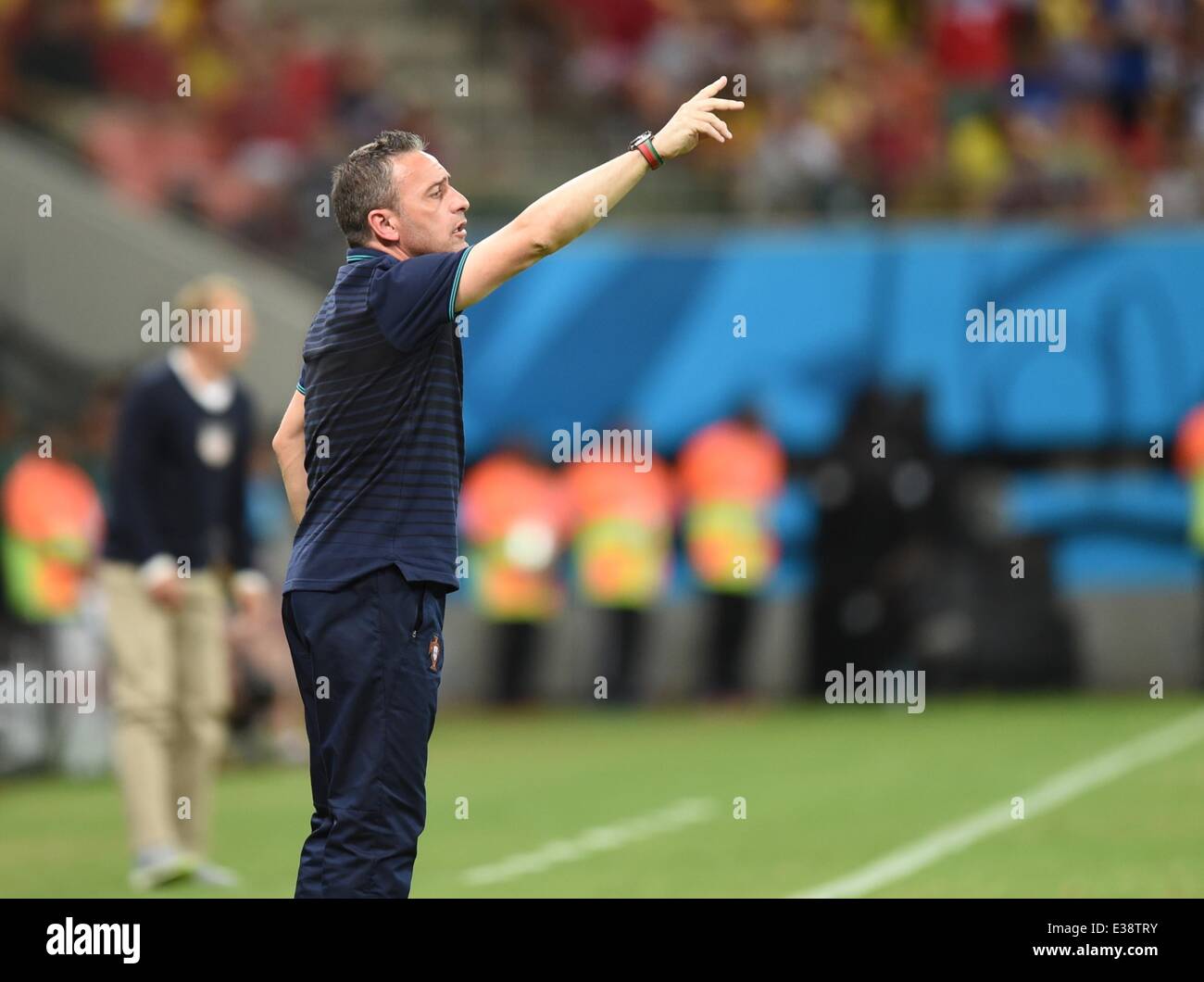 Manaus, Brazil. 22nd June, 2014. Head coach Paulo Bento (R) of Portugal reacts next to head coach Juergen Klinsmann (L) of USA during the FIFA World Cup 2014 group G preliminary round match between the USA and Portugal at the Arena Amazonia Stadium in Manaus, Brazil, 22 June 2014. Photo: Marius Becker/dpa/Alamy Live News Stock Photo