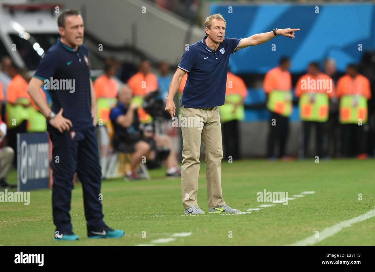 Manaus, Brazil. 22nd June, 2014. Head coach Paulo Bento (L) of Portugal reacts next to head coach Juergen Klinsmann (R) of USA during the FIFA World Cup 2014 group G preliminary round match between the USA and Portugal at the Arena Amazonia Stadium in Manaus, Brazil, 22 June 2014. Photo: Marius Becker/dpa/Alamy Live News Stock Photo