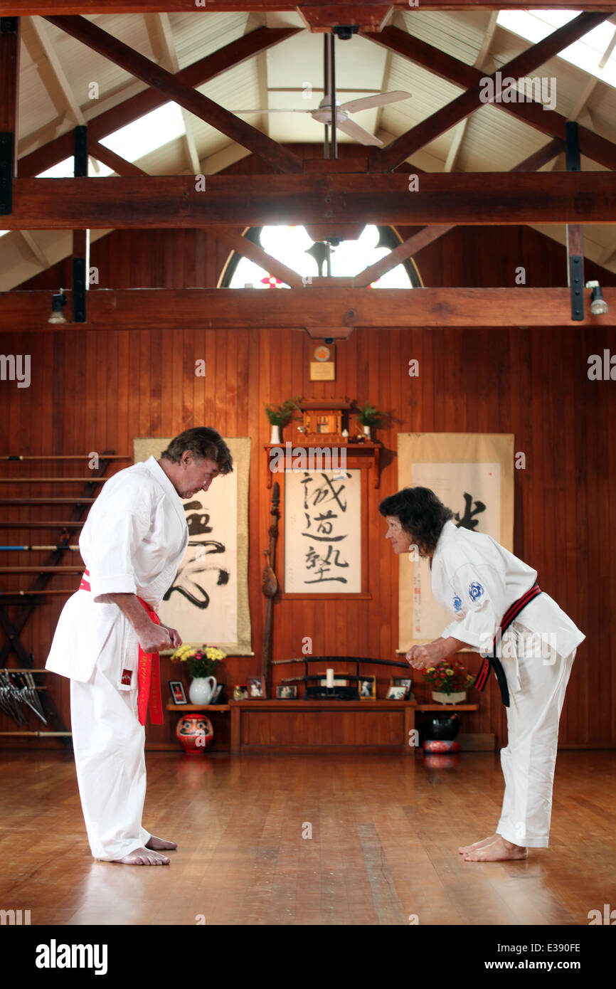 World class black belts Hanshi Andy Barber and Jun Shihan Jane Barber in their seido karate dojo, Nelson, New Zealand Stock Photo