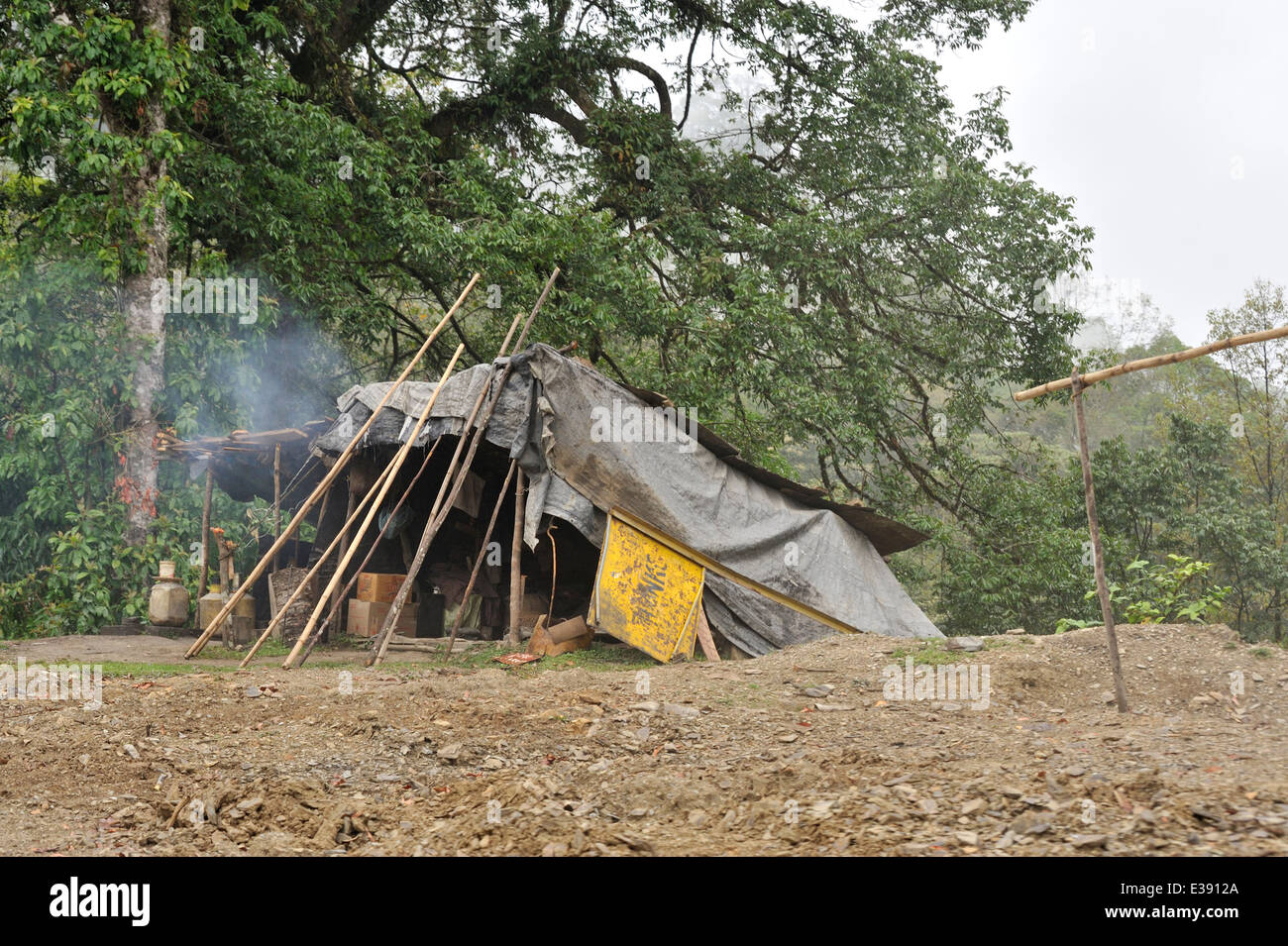 Dwellings of immigrants from Nepal, locally known as Lhotshampa, who work maintaining roads in Bhutan Stock Photo