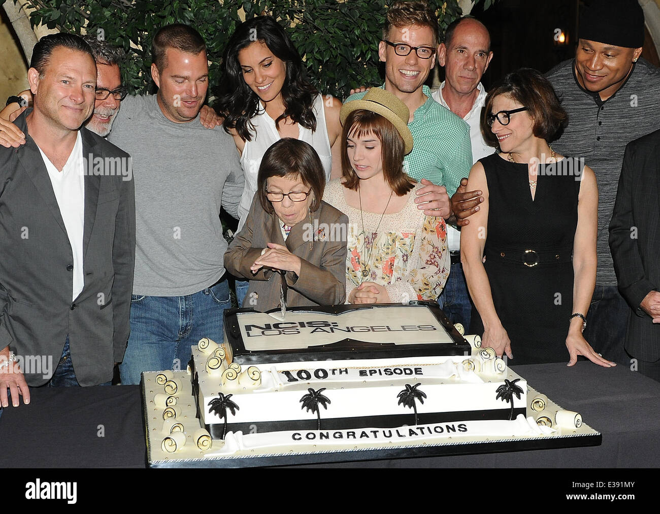 Cast and crew of NCIS: LOS ANGELES on set for a cake-cutting to celebrate the filming of their 100th episode.  (Episode to air on Tuesday, October 15th)  Featuring: Eric Christian Olsen,R. Scott Gemmill,John Peter Kousakis,Chris O'Donnell,Daniela Ruah,Lin Stock Photo