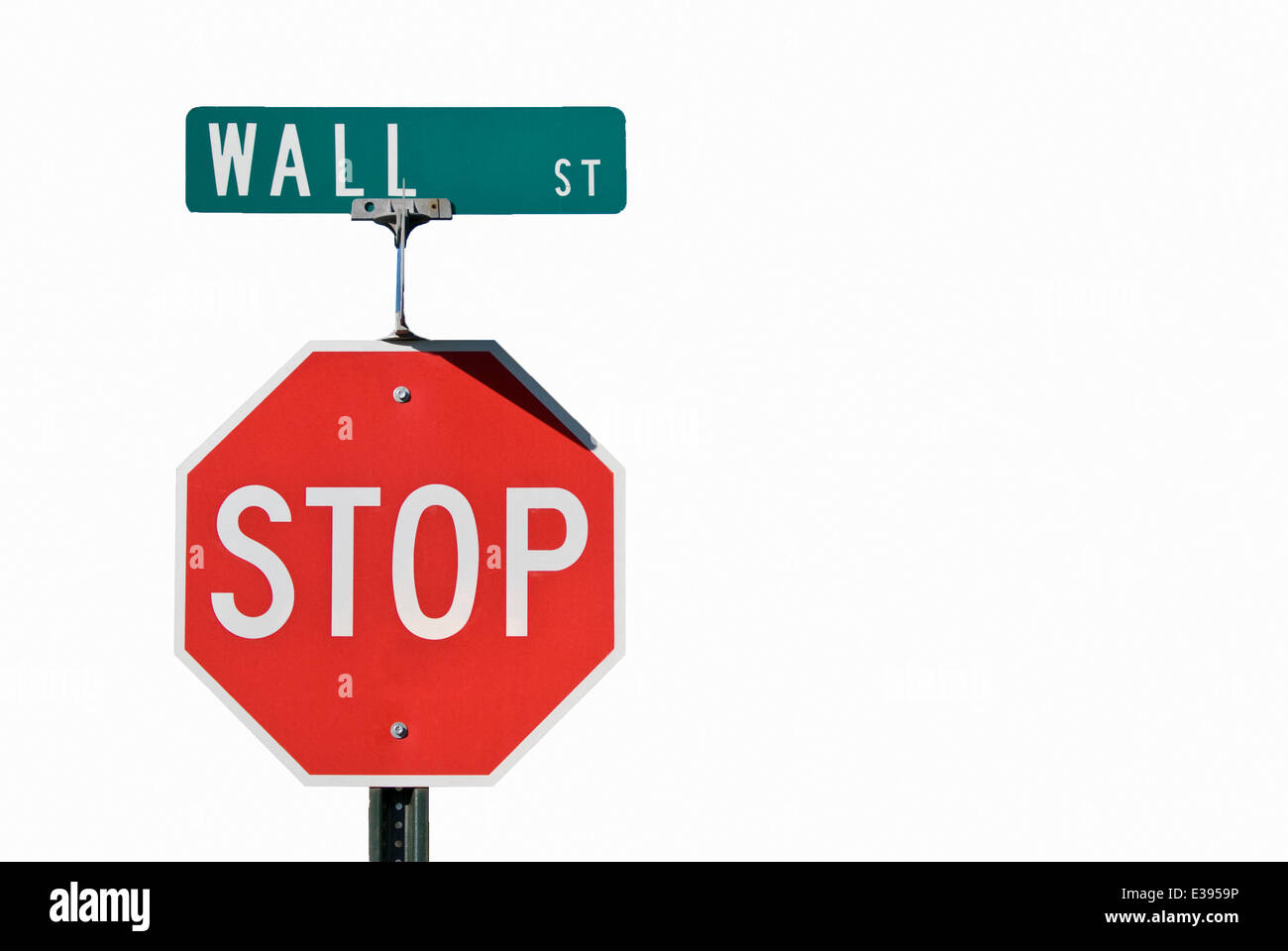Wall street and stop signs on same post Stock Photo