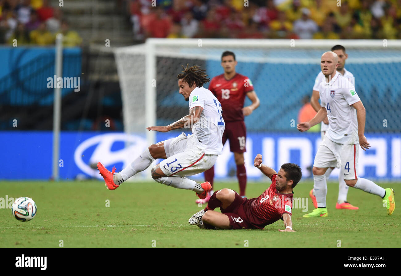 Manaus, Brazil. 22nd June, 2014. Joao Moutinho (C) of Portugal in action against Jermaine Jones (L) of USA during the FIFA World Cup 2014 group G preliminary round match between the USA and Portugal at the Arena Amazonia Stadium in Manaus, Brazil, 22 June 2014. Photo: Marius Becker/dpa/Alamy Live News Stock Photo