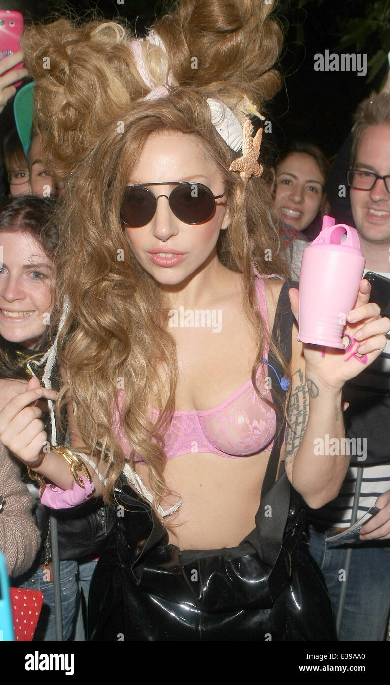 Lady Gaga leaving her hotel wearing a pink see through bra and black pvc  dungarees with high heel boots carrying a pink milkshake glass Featuring:  Lady Gaga Where: London, United Kingdom When: