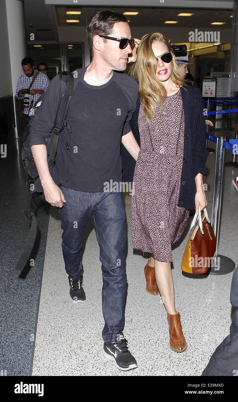 Newlyweds Kate Bosworth and Michael Polish arrive at LAX airport on a flight. The couple married on Saturday (31Aug) during an outdoor ceremony at The Ranch at Rock Creek in Philipsburg, Montana.  Featuring: Kate Bosworth,Michael Polish Where: Los Angeles Stock Photo