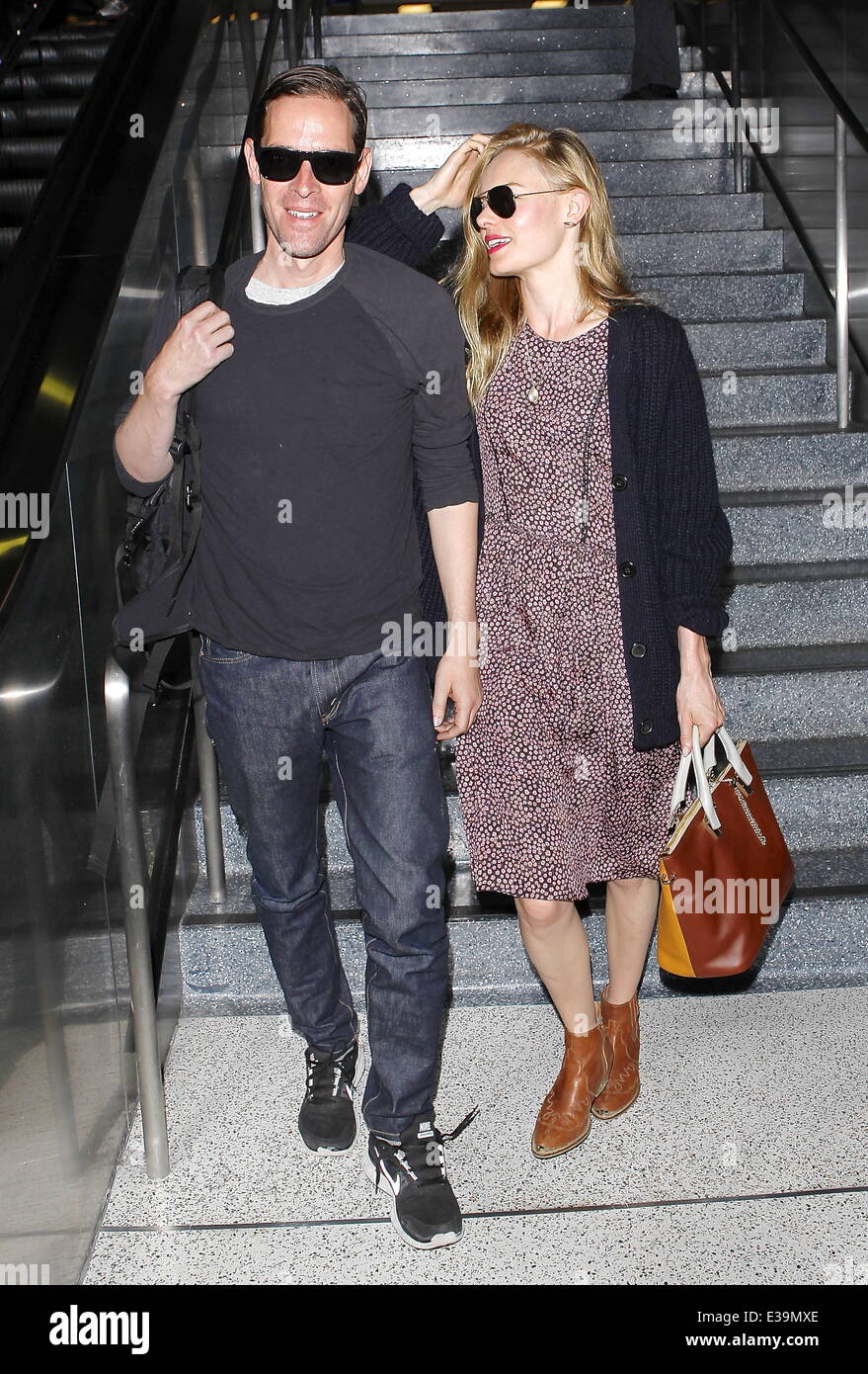 Newlyweds Kate Bosworth and Michael Polish arrive at LAX airport on a flight. The couple married on Saturday (31Aug) during an outdoor ceremony at The Ranch at Rock Creek in Philipsburg, Montana.  Featuring: Kate Bosworth,Michael Polish Where: Los Angeles Stock Photo