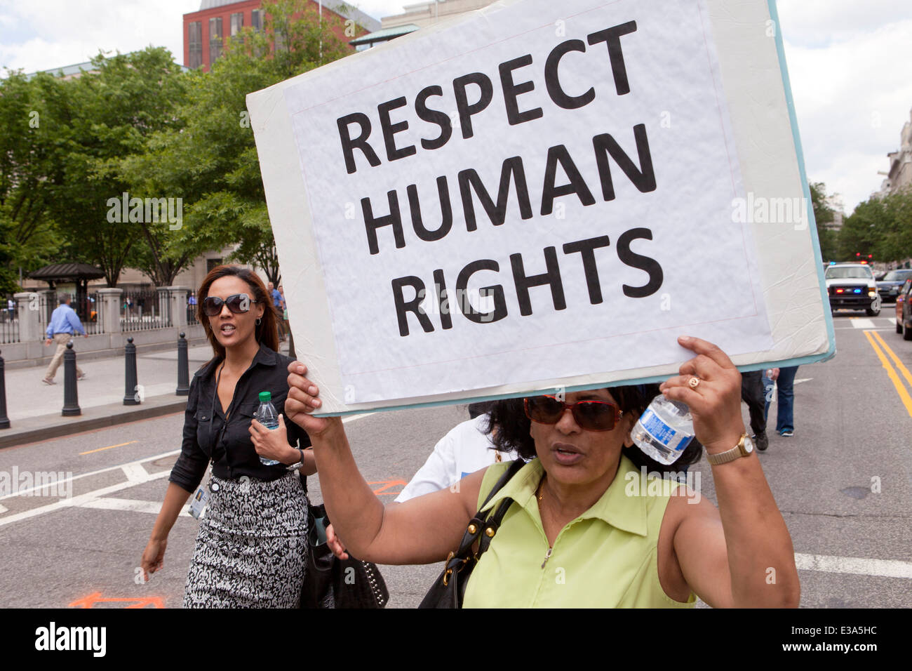 Human rights activist holding sign - Washington, DC USA Stock Photo