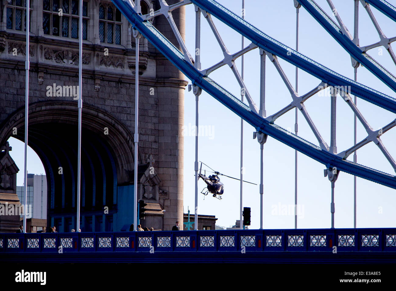 Actor Sean Penn filming the his new movie 'The Gunman' on Tower Bridge in London. The scene features a helicopter flying low over the iconic London landmark as Penn walks across the River Thames  Featuring: Sean Penn Where: London, United Kingdom When: 08 Sep 2013 Stock Photo