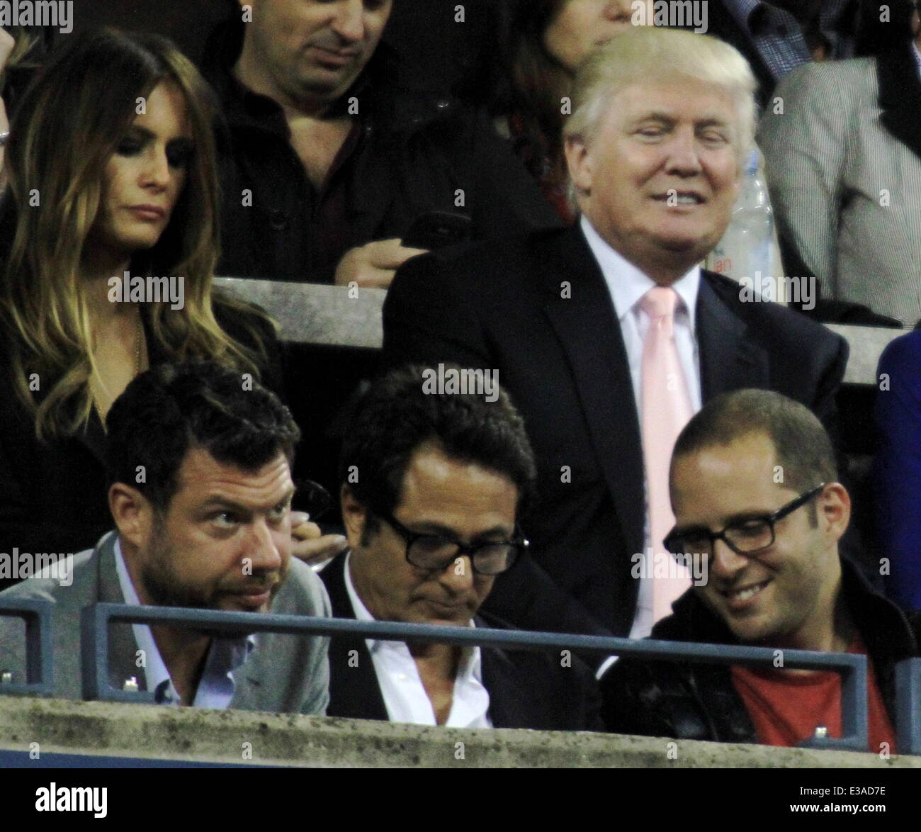 Celeberties came out in style to watch the Mens Final at the 2013 US Tennis Open.  Featuring: Donald Turmp,Milania Trump Where: New York City, NY, United States When: 10 Sep 2013 Stock Photo