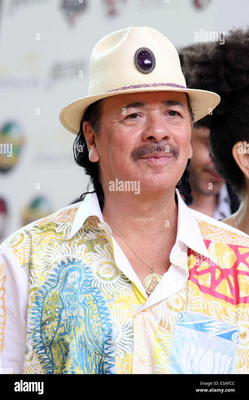 ANDRE AGASSI Joins CARLOS SANTANA For Musical Instrument Donation At