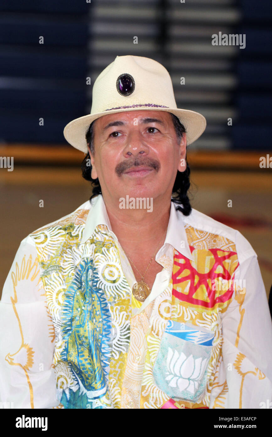 ANDRE AGASSI Joins CARLOS SANTANA For Musical Instrument Donation At