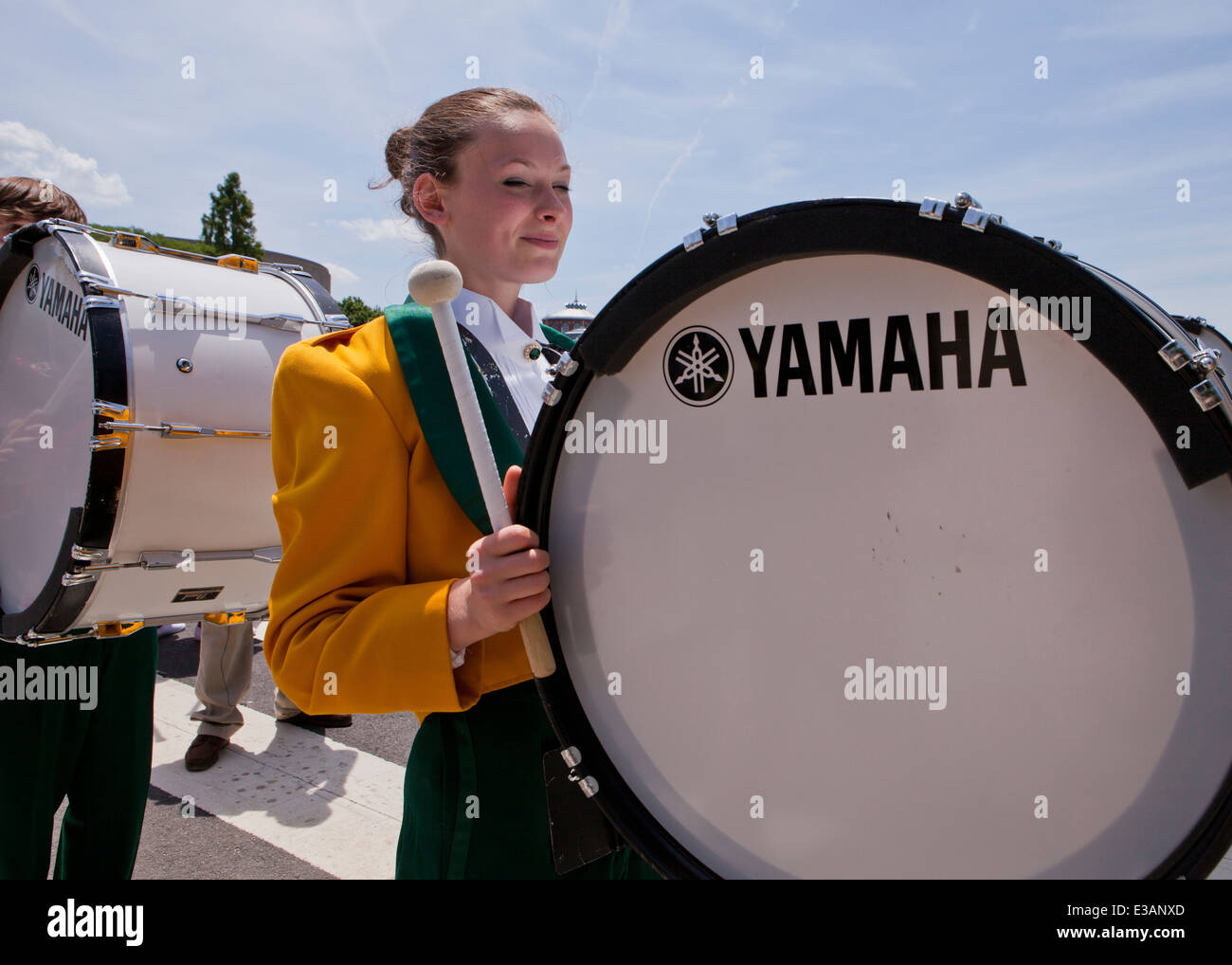 Female bass drummer in high school marching band - USA Stock Photo