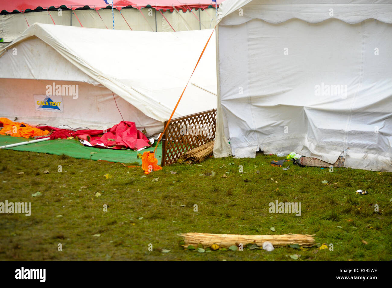 Due to further winds forecast for the United Kingdom. Workmen re-enforce the arena tents at the Festival Number 6  Where: Portmeirion, Wales When: 15 Sep 2013 Stock Photo