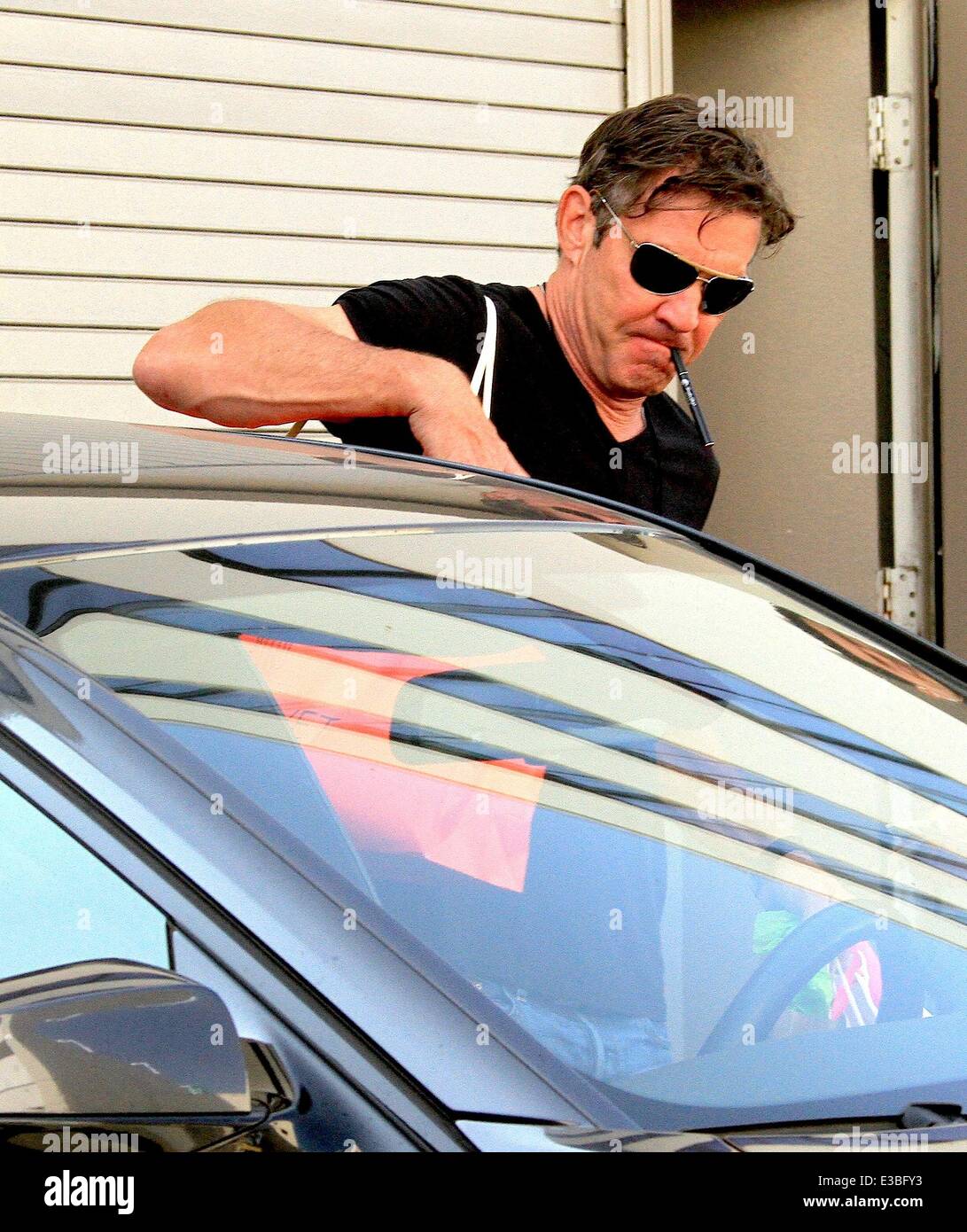 Dennis Quaid leaving The Luxe Hotel in Beverly Hills smoking a 'Smoke Stik'  e-cigarette Featuring: Dennis Quaid Where: Los Angeles, CA, United States  When: 19 Sep 2013 Stock Photo