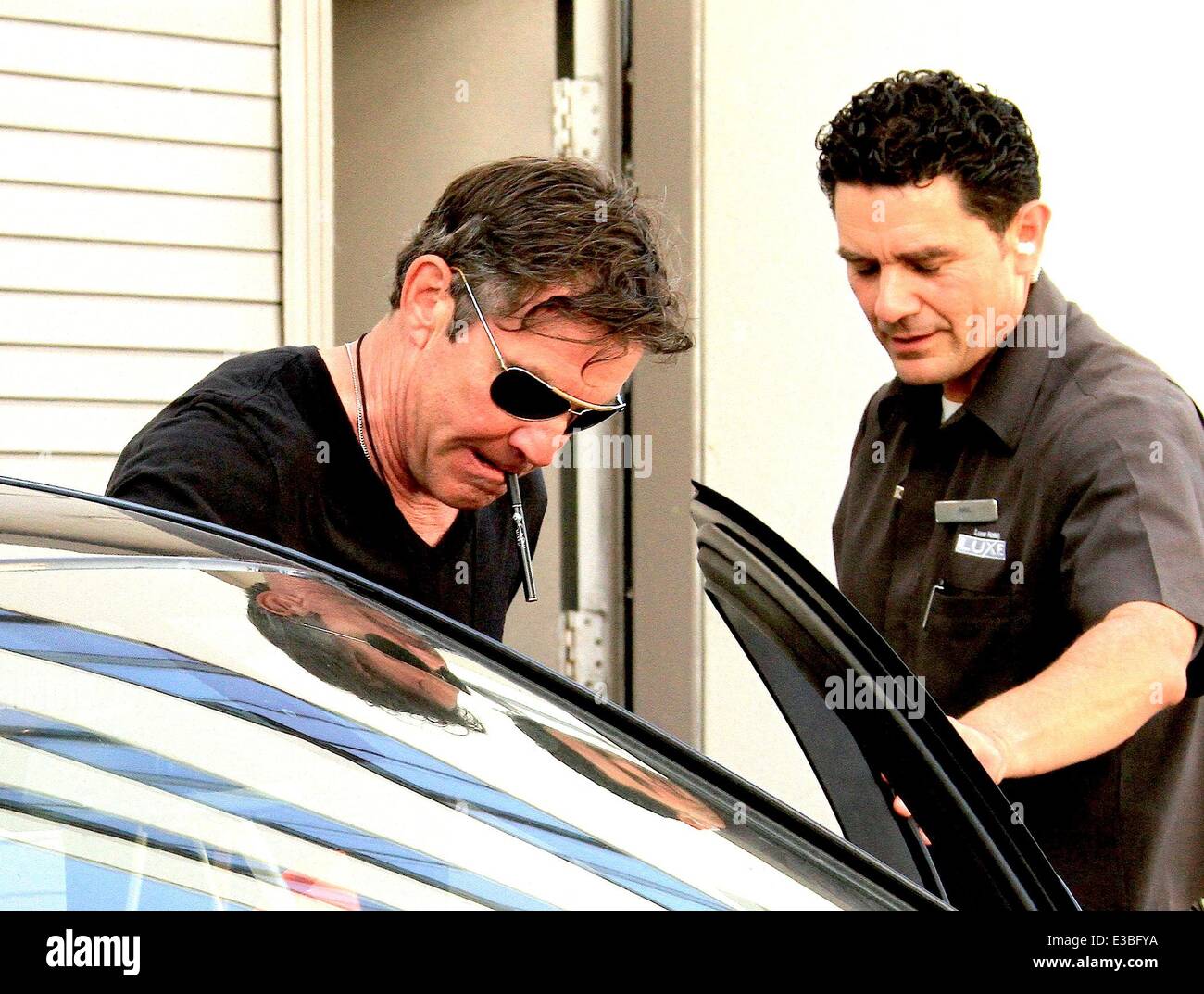 Dennis Quaid leaving The Luxe Hotel in Beverly Hills smoking a 'Smoke Stik'  e-cigarette Featuring: Dennis Quaid Where: Los Angeles, CA, United States  When: 19 Sep 2013 Stock Photo