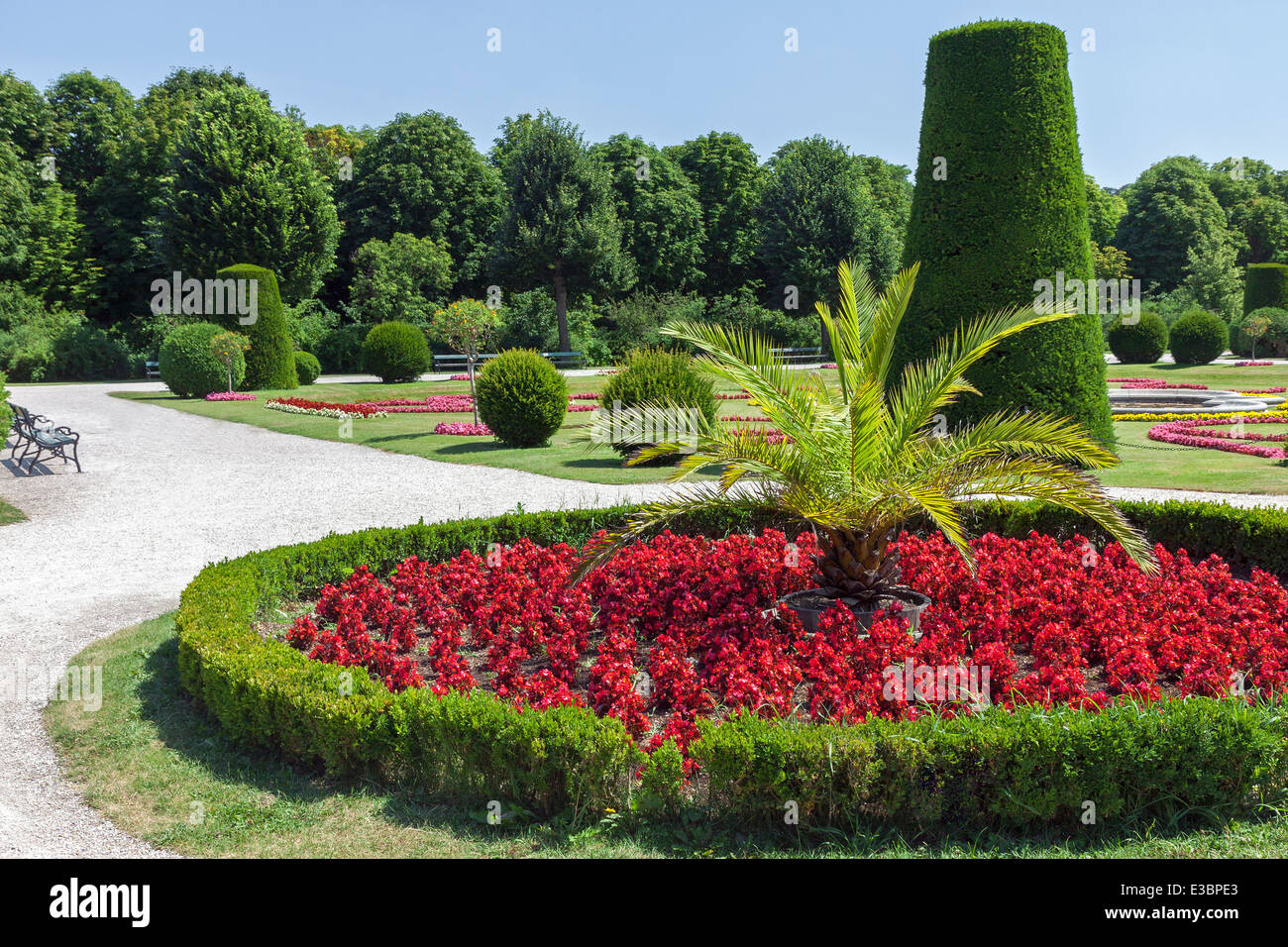 Beautiful landscaped Schonbrunn park in Vienna with flowers and green trees Stock Photo