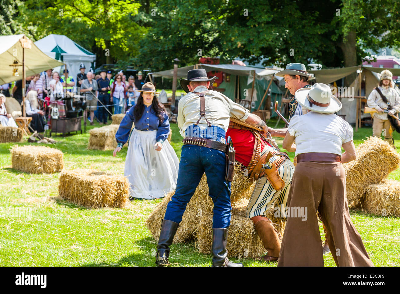 Leek, Staffordshire, England. 22nd June 2014, A Country and Western Weekend. A Lynch mob threaten to hang Villain Cowboy. Stock Photo