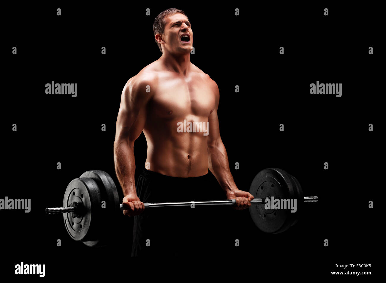 Bodybuilder exercising with a barbell Stock Photo