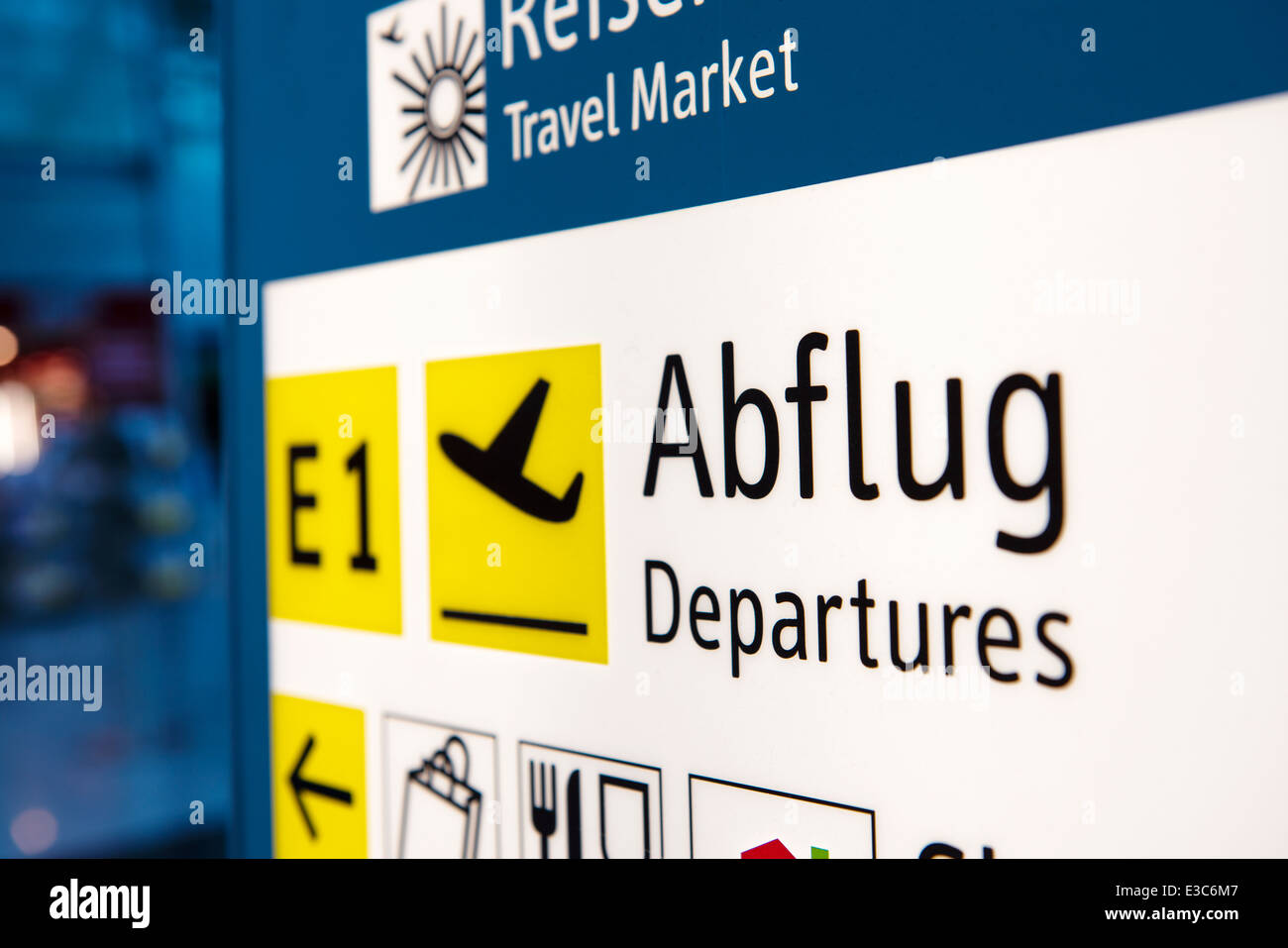 Brightly light departures airport information sign Stock Photo