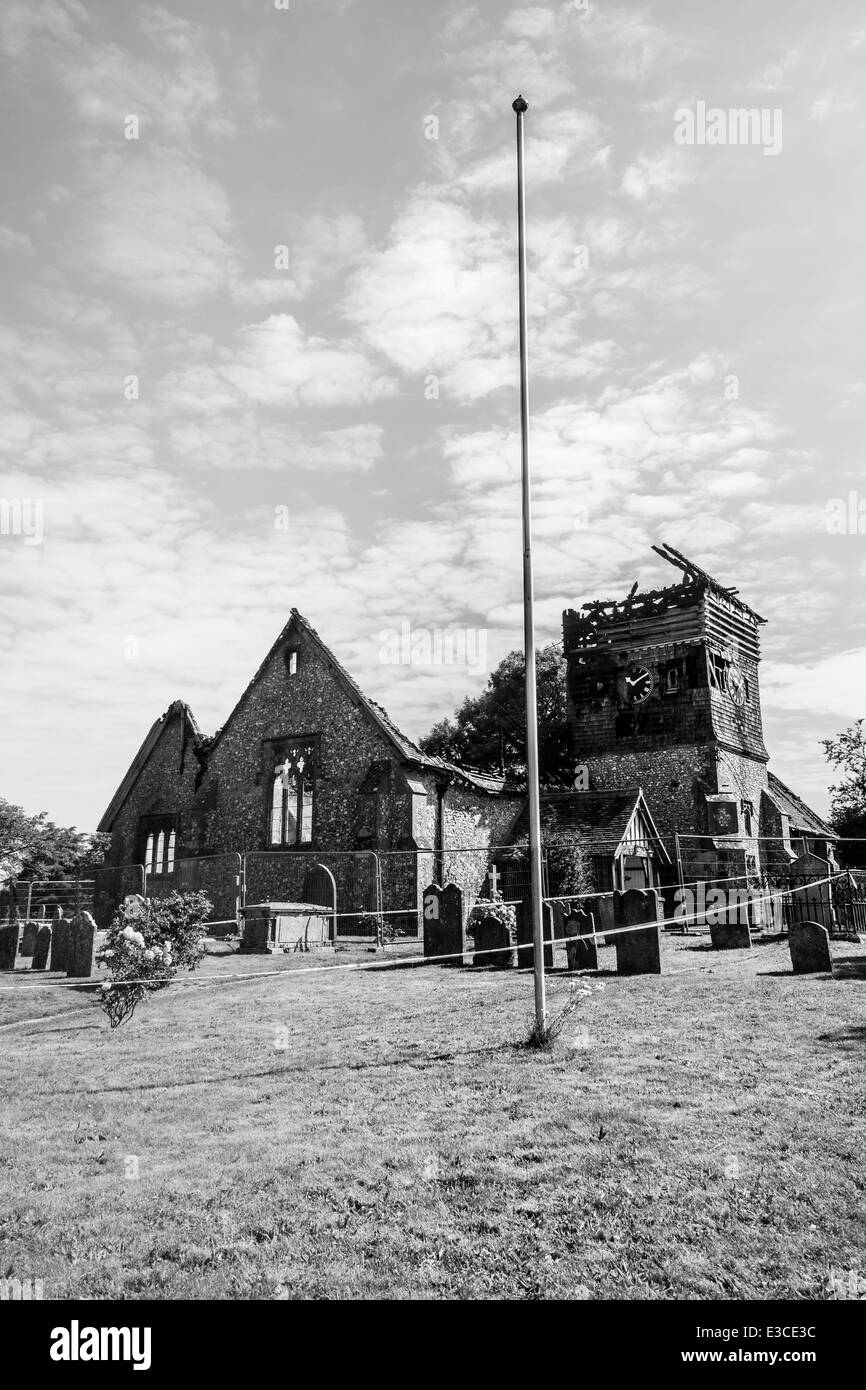 The burnt remains of St Peters Church in Ropley, Hampshire , England. Following a fire on the morning of 19th June 2014. Stock Photo